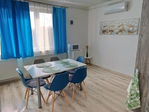 a dining room with a table and chairs at Diana Panzió in Mátrafüred