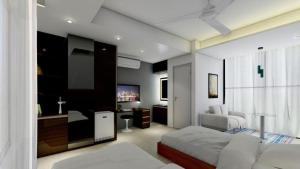 a bedroom with a bed and a tv in it at White Park Boutique Hotel in Chittagong