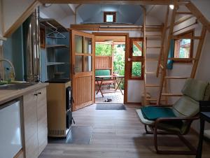 a tiny house with a kitchen and a living room at Pravda in Loket