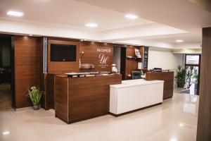 an office with a reception desk and a tv at Dabas Hotel in Dabas