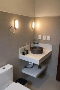 a bathroom with a sink and a toilet at Pousada Green House Paraty in Paraty +5 photos