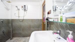 a bathroom with a shower and a sink at Tranquil Guest in Sigiriya +75 photos
