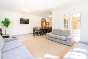 a living room with a couch and a table at Villa Trobadors in El Arenal