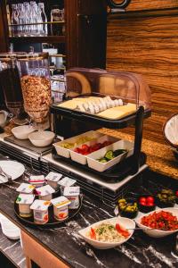 a buffet line with food on a table at Dabas Hotel in Dabas