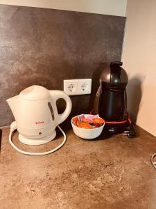 a coffee maker and a tea kettle on a counter at B&B Pardoen in Poortugaal +38 photos