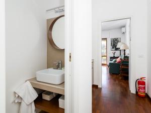 a bathroom with a sink and a mirror at La Perla Rara in Sant'Agnello +37 photos