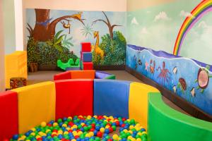 a childs play room with a heap of balls at Reef & Beach Resort - Spa Jambiani in Jambiani