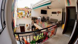 a hallway of a house with a room with a staircase at Hostal Barrio Abajo in Barranquilla