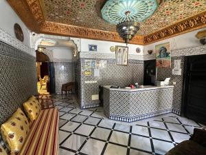 a large room with a tile floor and a ceiling at Riad Fes Bab Rcif Suite &Spa in Fez