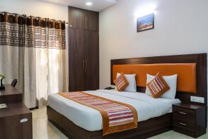 a bedroom with a large bed in a room at SKS Hospitality in Gurgaon