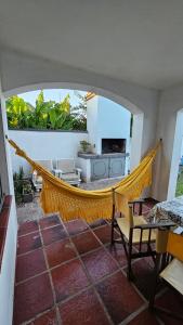 a hammock in the middle of a living room at Casona El Rosedal in Bell Ville