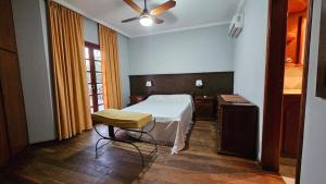 a bedroom with a bed and a ceiling fan at Casona El Rosedal in Bell Ville +15 photos