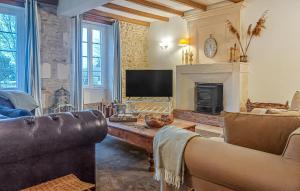 a living room with a couch and a fireplace at Luxueuse Maison Avec Piscine in Cravans