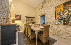 a dining room with a table and chairs at Luxueuse Maison Avec Piscine in Cravans