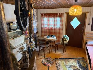 a room with a table and a dining room at Rokova Dolina in Draganovac