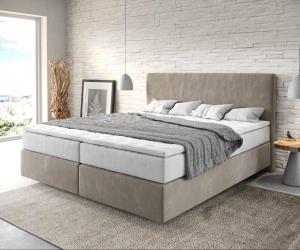 a bedroom with a large bed and a white brick wall at SunSet - Ruhig & Zentral - Komfort Apartment Nähe Altstadt & DOM in Cologne