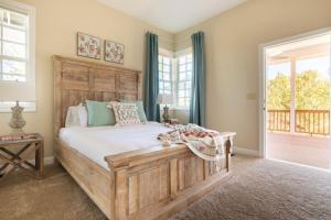 a bedroom with a large wooden bed and a window at Blue Stone Chateau Yosemite Pool Spa Secluded in Abbeyville +64 photos