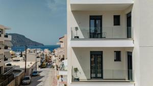 a view of a city from a building at Opulence12 Suites in Karpathos