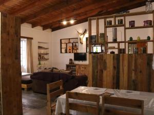 a living room with a couch and a table at Wild Eden Self-Catering Accommodation in Swakopmund