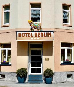 a hotel berlin sign on the front of a building at Hotel Berlin in Leipzig