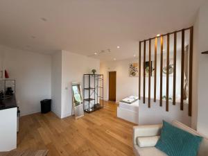 a living room with a couch and a table at The Kove Oceanview in Bournemouth
