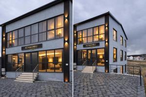 a large building with lights on the side of it at ATAKORU Suit in Alacaatlı