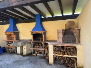 a room with two brick ovens in a building at Arandi Baserria in Murueta-Orozko +75 photos