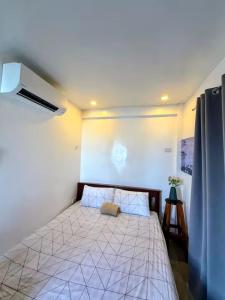 a bedroom with a bed in a room at DJL Beach House - Bantayan Island in Patao
