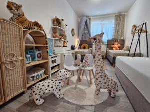 a childs play room with toy animals in a room at FAMILY HOUSE - ideální pro rodiny s dětmi in Olomouc