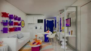 a living room with a white couch and purple and white walls at Symone - Poitiers in Poitiers