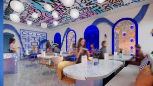 a restaurant with blue arches and people sitting at tables at Symone - Poitiers in Poitiers