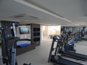 a gym with rows of tread machines in a room at Residence Flat Prime Itaboraí in Itaboraí