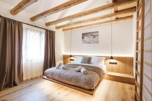 a bedroom with a bed with two pillows on it at Chalet Charm - Private Mountain Retreat with Sauna, Jacuzzi & Kids Playroom in Bansko