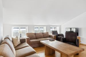 a living room with a couch and a coffee table at Stølstunet Leilighet 617 in Beitostøl