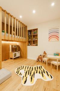 a living room with a zebra rug on the floor at Chalet Charm - Private Mountain Retreat with Sauna, Jacuzzi & Kids Playroom in Bansko