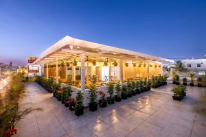 a building with a lot of plants in front of it at AIRA Boutique Hotel in Bangalore
