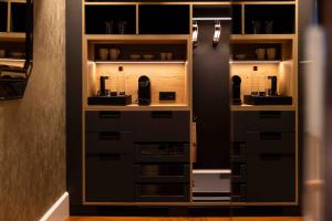 a room with a cabinet with some items in it at Maison Pic in Valence