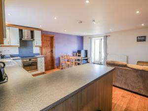 a kitchen with a large counter top in a room at Swallows Rest in Hexham