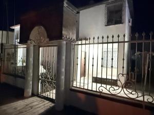 a gate to a house with a fence at Colorín RB in La Paz