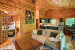 a living room with a couch in a log cabin at Havenridge in Logan