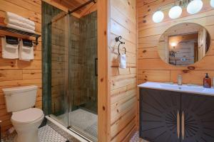 a bathroom with a shower and a toilet and a sink at Havenridge in Logan +28 photos