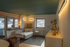 a bedroom with a bed and a table and chairs at Berg Glück Axams in Innsbruck