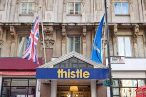 a sign for a thrisel store in front of a building at Thistle London Piccadilly in London