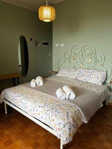 a bedroom with a bed with pillows on it at BellaVista in Saluggia