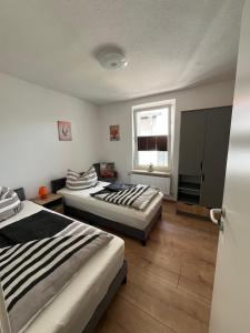 Llit o llits en una habitació de Neubauer