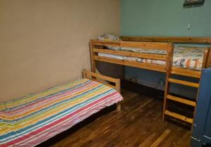 a bedroom with two bunk beds and a bed at Gîte Pierre, Beynat, Corrèze in Beynat