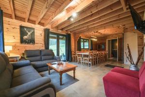 a living room with a couch and a table at Gites de la Semois in Laviot