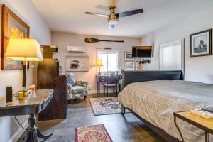 a bedroom with a bed and a living room at 3 Mi to Dtwn Monticello! Waterfront Studio Getaway in Monticello