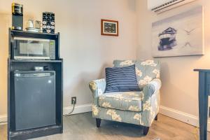 a living room with a chair and a microwave at 3 Mi to Dtwn Monticello! Waterfront Studio Getaway in Monticello +13 photos