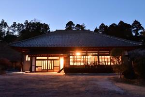 a japanese house with a lit up room with a lighted at 愛敬家 in Mobara